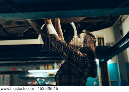 Car Reapir, Exam. Young Pretty Girl, Auto Mechanic Working At Auto Service Station Using Different W