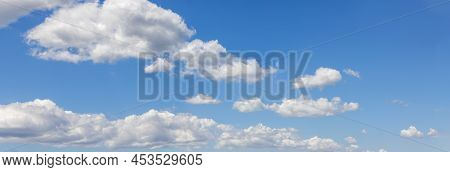 Panoramic View Of White Cumulus Clouds On Midday Blue Bottomless Sky Background High Contrast