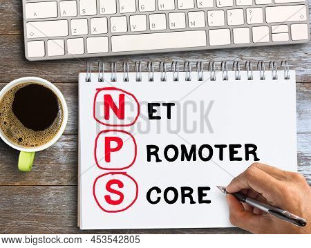 Top View Text With Nps On Notebook With Pencil,keybroad And Coffee On Wood Table Background In Offic