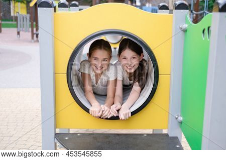 Sisterhood, Friendship. Two Charming Teen Girls Having Fun On A Modern Playground. Sister, Bffs Comm