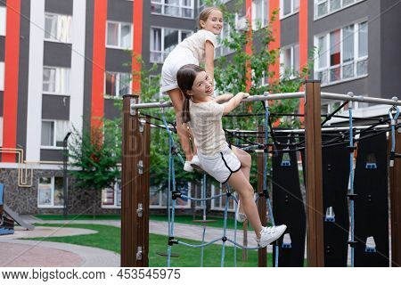 Sisterhood, Friendship. Two Charming Teen Girls Having Fun On A Modern Playground. Sister, Bffs Comm