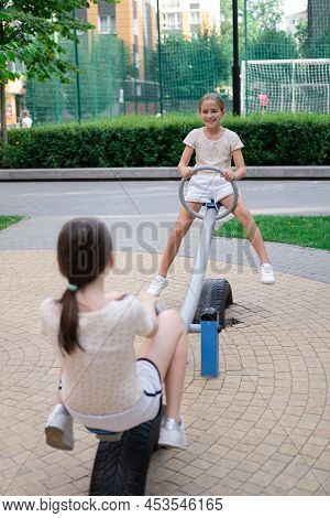 Sisterhood, Friendship. Two Charming Teen Girls Having Fun On A Modern Playground. Sister, Bffs Comm