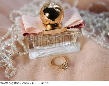Engagement Ring And A Perfume Close Up, Gold, White And Pink Colors, Beaytiful Wedding Details, Brid