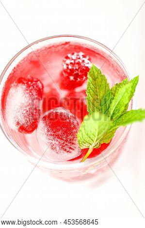 Raspberry Cocktail.summer Drink.raspberry Pink Drink.ice Cubes With Raspberries In A Glass With Wate