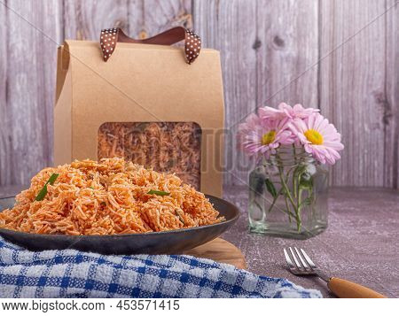 Sweet And Sour Crispy Noodles Or Mee Krob In The Thai Language On A Dish With Cloth, Vase Placed On 