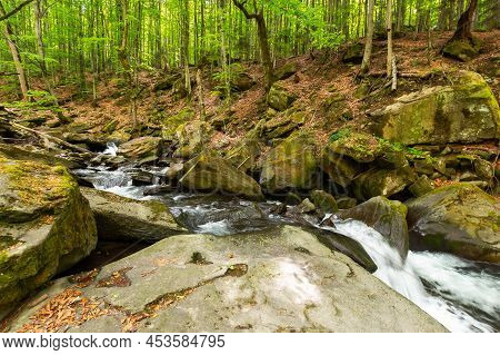 Shypot Stream In The Forest. Refreshing Scenery In Springtime. Water Flowth Through Rocks And Boulde