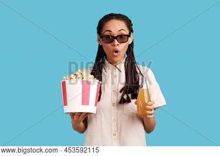 Extremely Astonished Woman With Dreadlocks In 3d Imax Glasses Watching Movie Film, Hold Popcorn And 