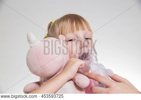 A 5-year-old Girl Breathes Into An Inhaler To Dilute Sputum In Case Of Lung Diseases. Treatment Of C