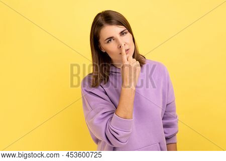 Portrait Of Woman Looking With Incredulous Gaze And Touching Nose, Gesturing You Are Liar, Suspectin
