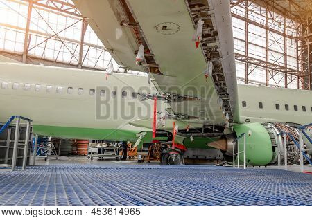 Maintenance And Repair Of A Passenger Aircraft Wing. Wing Flaps Disassembled Released.
