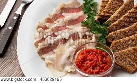 Raw Chopped Pork Lard With Meat, A Head Of Garlic And Rye Bread On A Wooden Background For Copy Spac
