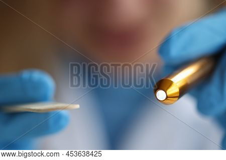 Ent Is Wearing Gloves And Holding Flashlight And Throat Otorhinolaryngological Set . Methods For Exa