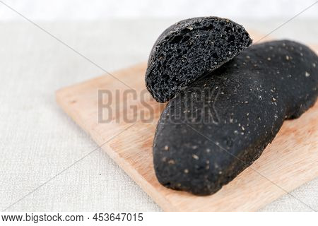 Black Long John Buns Bread With Copy Space For Text