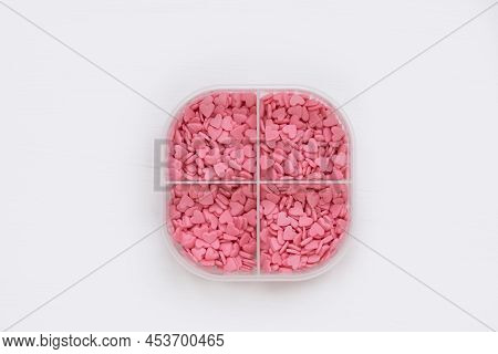 In The Pill Box, Instead Of Pills, There Are Small Pink Hearts. The Concept Of Treatment With Love A