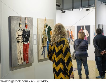 Parma, Italy - March 2022: People Admiring Paintings In A Modern Art Gallery.