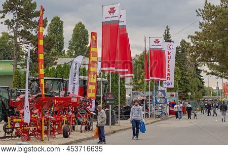 Novi Sad, Serbia - September 21, 2021: Helti Agriculture Equipment And Massey Ferguson Tractors At A