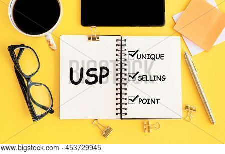 White Notebook With Inscription Usp Unique Selling Proposition Written In Black Pencil On A Bright Y