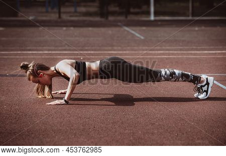Strong Fitness Woman Doing Push Ups For Chest And Arms Strength Workout. Female Muscular Motivated A
