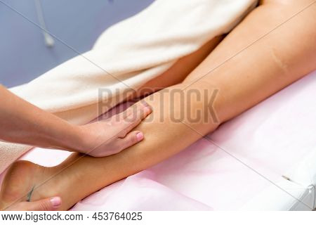 Facial Massage. A Woman Is Given A Massage In A Beauty Salon. Close-up.