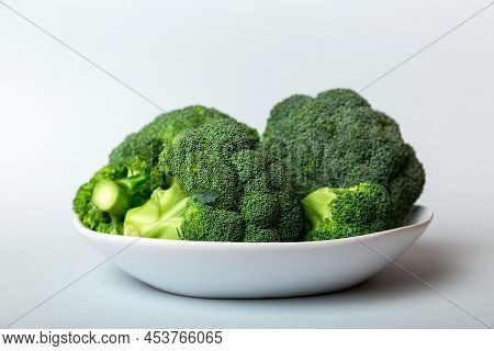 Broccoli Of Fresh Green Broccoli In Bowl Over Coloredbackground. , Close Up. Fresh Vegetable.