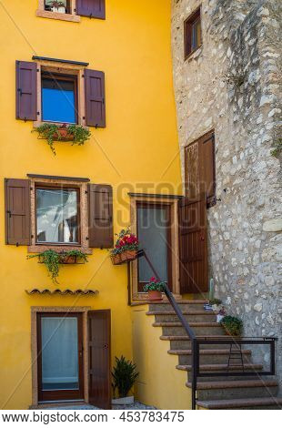 Malcesine, Italy - March 22, 2022:  A Traditional Colorful House At The Base Of The Scaligeri Castle
