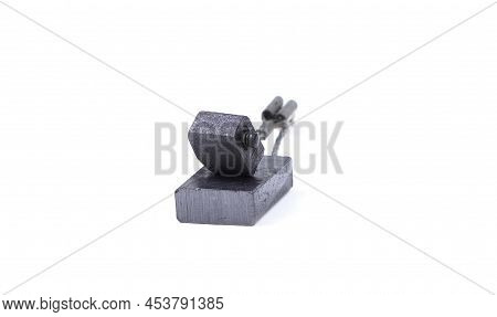 New And Old Carbon Brushes Isolated On A White Background. Brushes For Electric Motor.spare Parts Fo