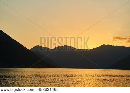View Of The Sunset In Boko-kotor Bay In Montenegro. Silhouettes Of Mountains