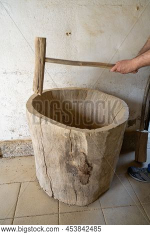Amarante, Portugal - April 30: Potter Performs The Manual Grinding Of Clay Using A Wooden Spike On A