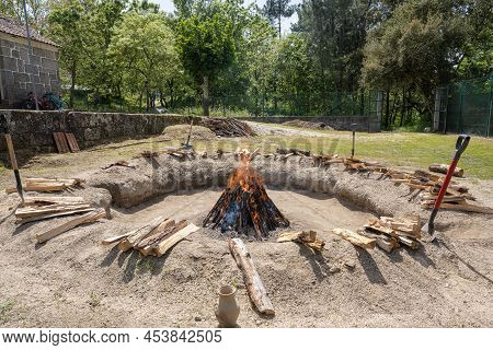 Amarante, Portugal - April 30: Bonfire With The Pieces Of Clay Stacked During The Process Of Cooking