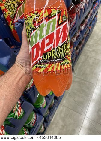 Grovetown, Ga Usa - 03 05 22: Retail Store Hand Holding Mtn Dew Uproar