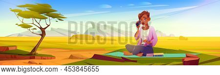 Woman With Smartphone Sitting On Mat With Books At Green Lawn Of Savanna Scenery Landscape With Tree