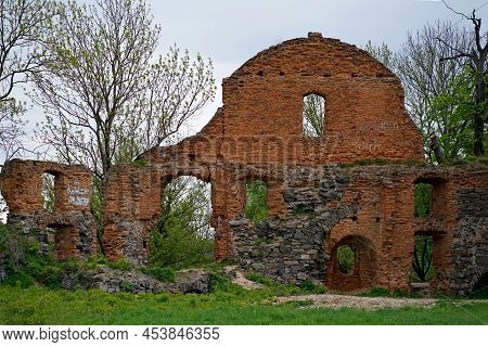 Ruins Of Expressive Red Brick Gate Tower Of Ancient Castle In Korets, Ukraine