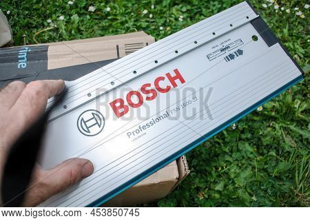 Paris, France - Apr 29, 2022: Worker Male Hand Pointing At The Bosch Professional Guide Rail With 32