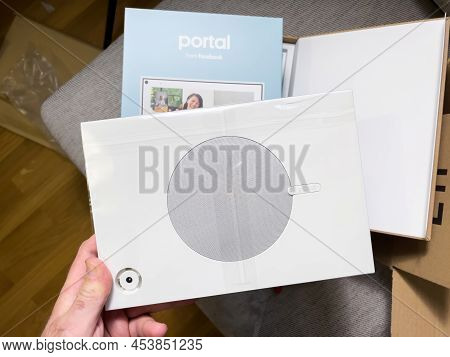 Paris, France - Apr 8, 2022: Pov Male Hand Looking At The Unboxed Facebook Portal - Brand Of Smart D