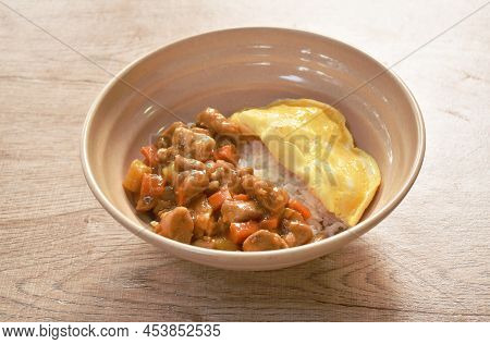 Chicken Curry With Fried Egg Topping On Rice In Bowl