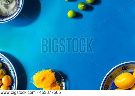 Background With Copy Space Of A Blue Table With Summer Fruits Such As Mangoes And Jocotes, Tradition