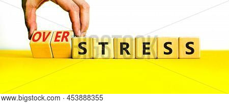 Over Stress Symbol. Psychologist Turns Wooden Cubes And Changes The Concept Word Stress To Over Stre
