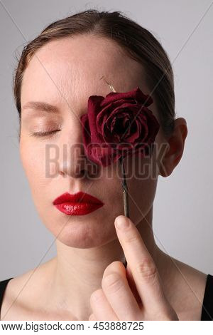 Middle Age Woman With Dry Rose. Skin Anti Agin Treatment. Vertical.