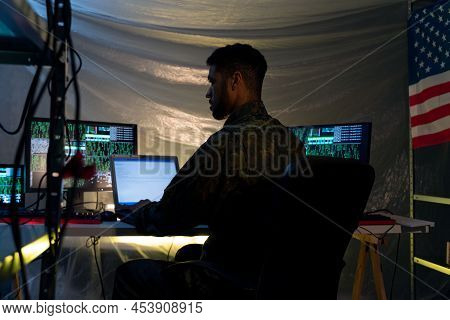 American Hacker In Military Unifrorm On Dark Web, Cyberwar Concept.