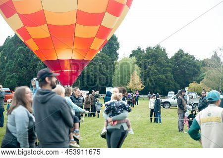 Masternon, New Zealand April, 22 2022 - People Attending Hot Air Balloon Festival In Masterton New Z