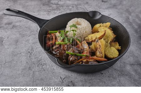 Peruvian D Food - Lomo Saltado - Beef Tenderloin With Purple Onion, Yellow Pepper, Tomatoes Served I