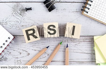 Rsi Text On A Wooden Block With Office Tools On The Wooden Background