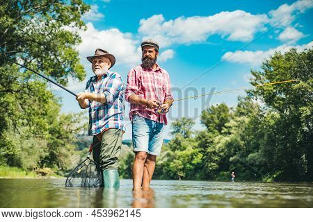 Men Hobby And Recreation. Fishermen Successful Catch Fish. Fisher Retirement. Retired Businessman In