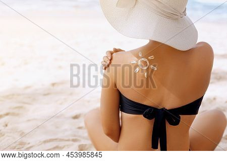 Suncream. Suntan Lotion Beautiful Woman Applying On Beautiful On Shoulder. Sunscreen Solar Cream. Sk