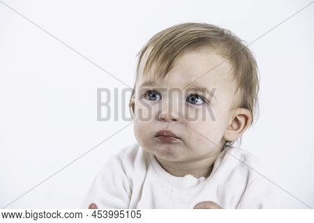 Stock Studio Photo With The White Background Of A Baby's Face