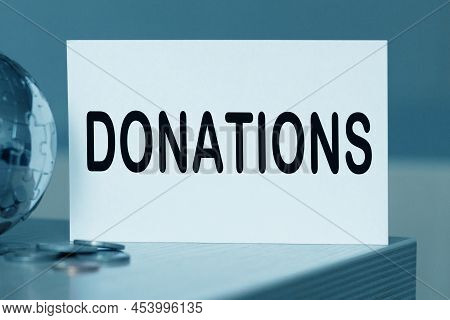 Charity Donation Concept. tinted picture. manet globe text
