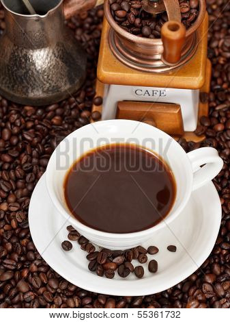 Cup Of Coffee And Roasted Beans