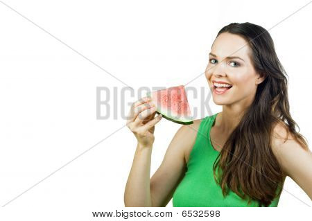 有吸引力的女孩举行西瓜和微笑