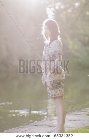 Portrait Of Deaming Romantic Girl Outdoors. Model With Long Stylish Hair