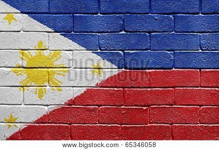 Flag of Philippines painted onto a grunge brick wall